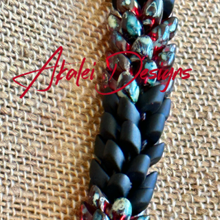 Pop-Up Mākeke - Akalei Designs - Transparent Red Picasso with Matte Black Dragon Scales "Kane" Necklace - Close Up - With Logo