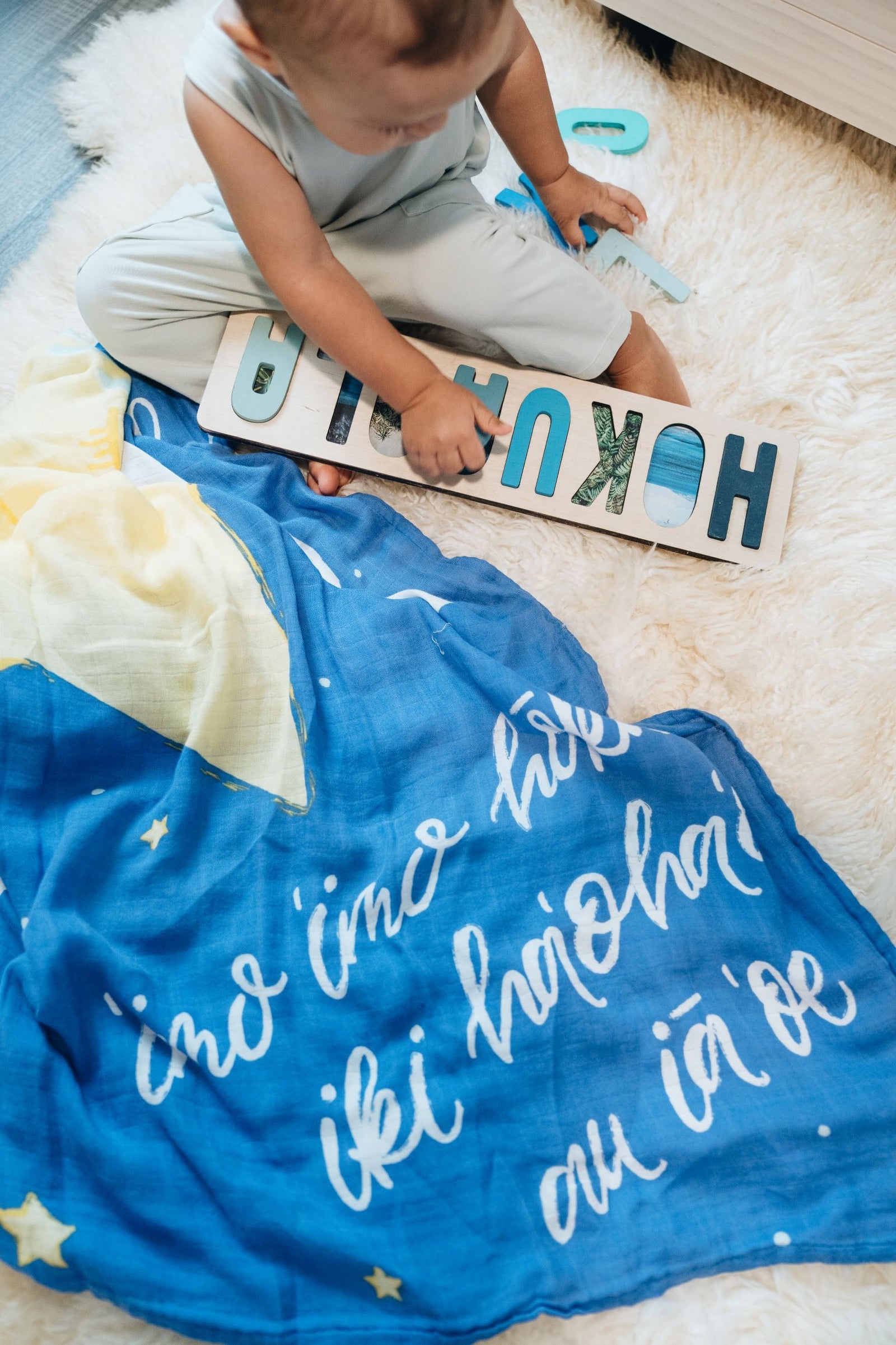 Pop-Up Mākeke - Haku Collective - Twinkle, Twinkle Little Hōkū Baby Swaddle - In Use