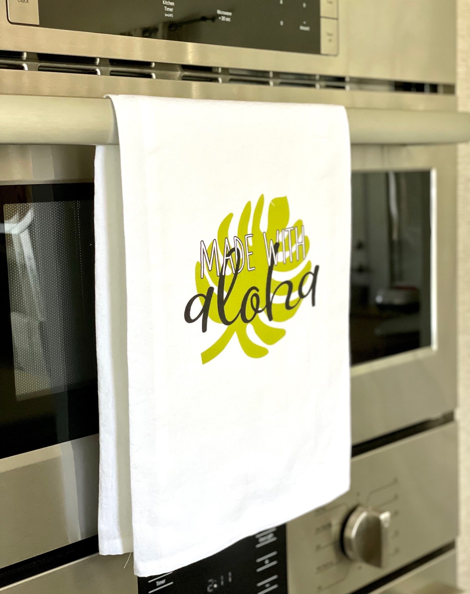 Pop-Up Mākeke - Sal Terrae - Flour Sack Kitchen Towel - Made with Aloha - Green Monstera - In Use