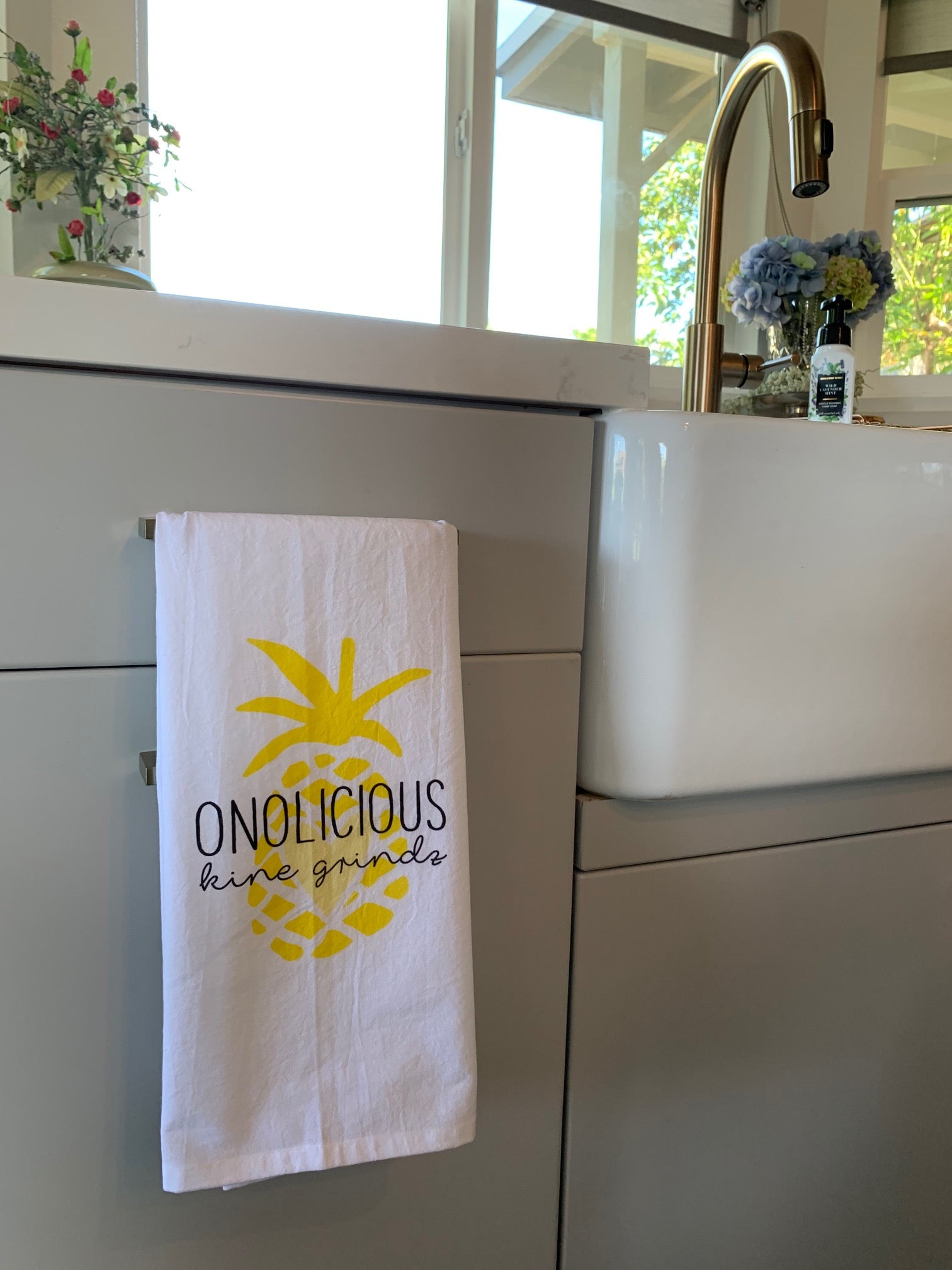 Pop-Up Mākeke - Sal Terrae - Flour Sack Kitchen Towel - Onolicious Kine Grindz - Yellow Pineapple - In Use