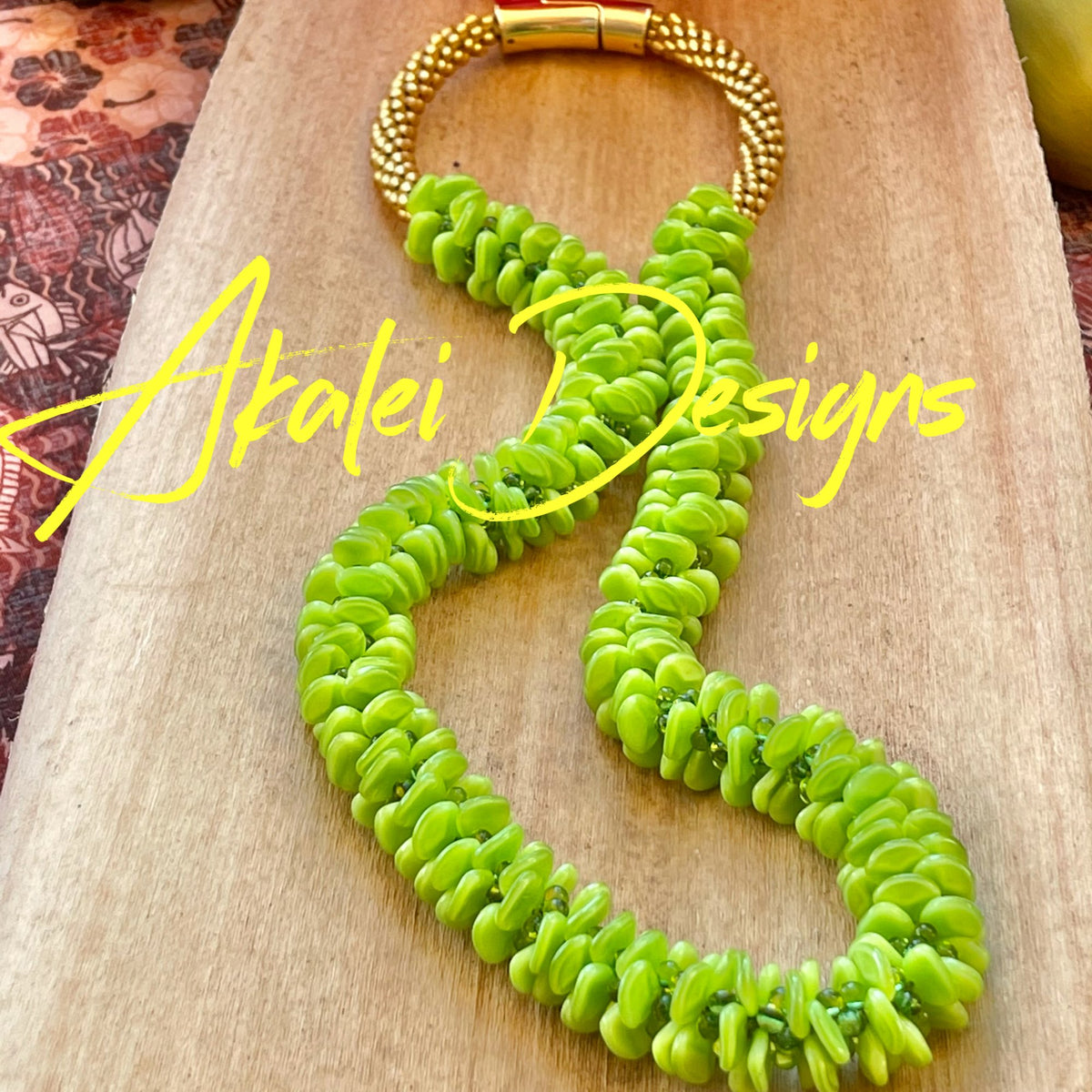 Pop-Up Mākeke - Akalei Designs - Bright Green Orchid Lei - Laid Down - With Logo