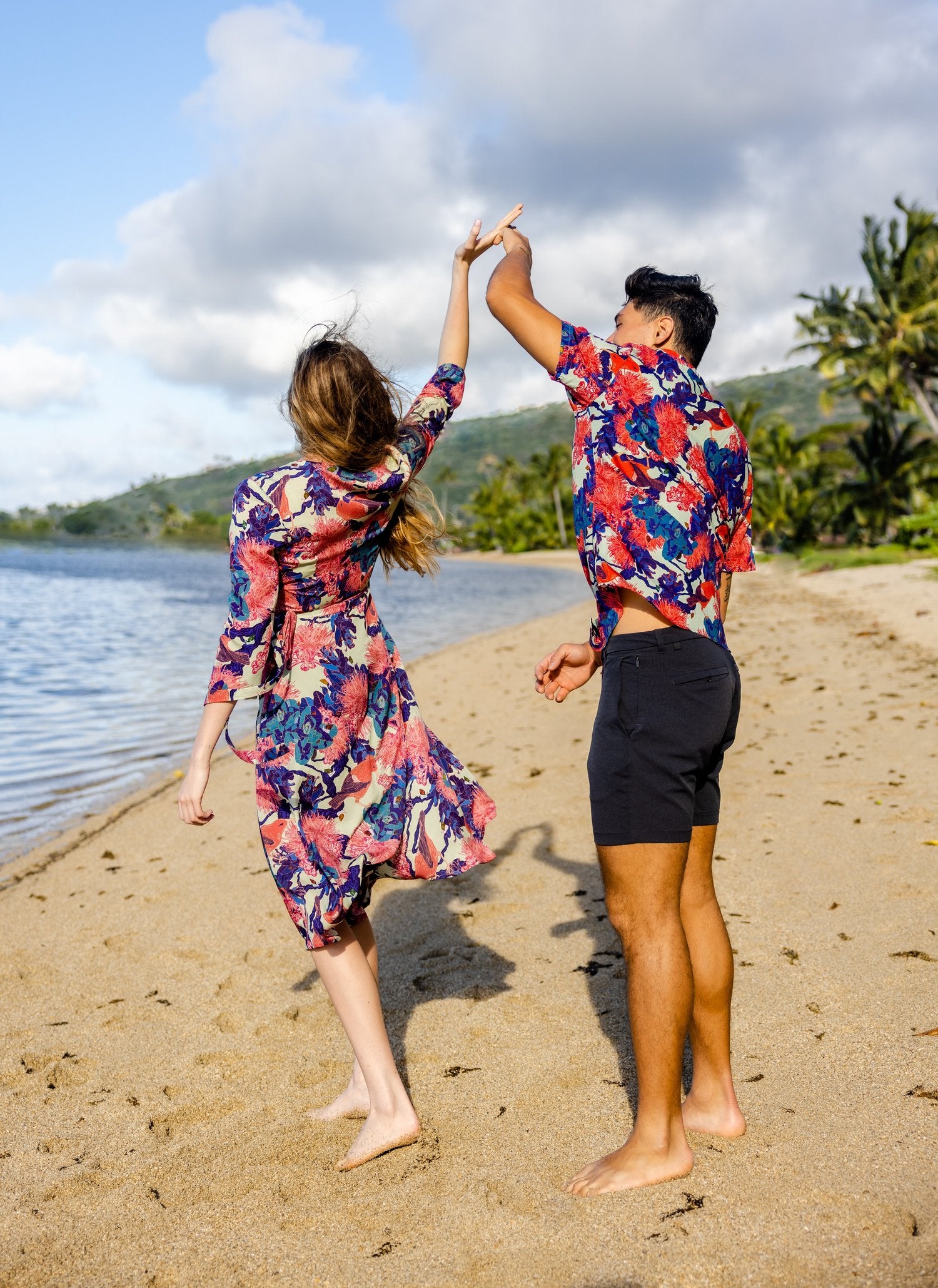 Pop-Up Mākeke - David Shepard Hawaii - Kaniakapūpū Lehua 'Ula Women's Midi Wrap Dress - With Male Model