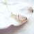 Pop-Up Mākeke - Flotsam & Co. - 24kt Gold Dipped Spiral Shell Necklace - Side View