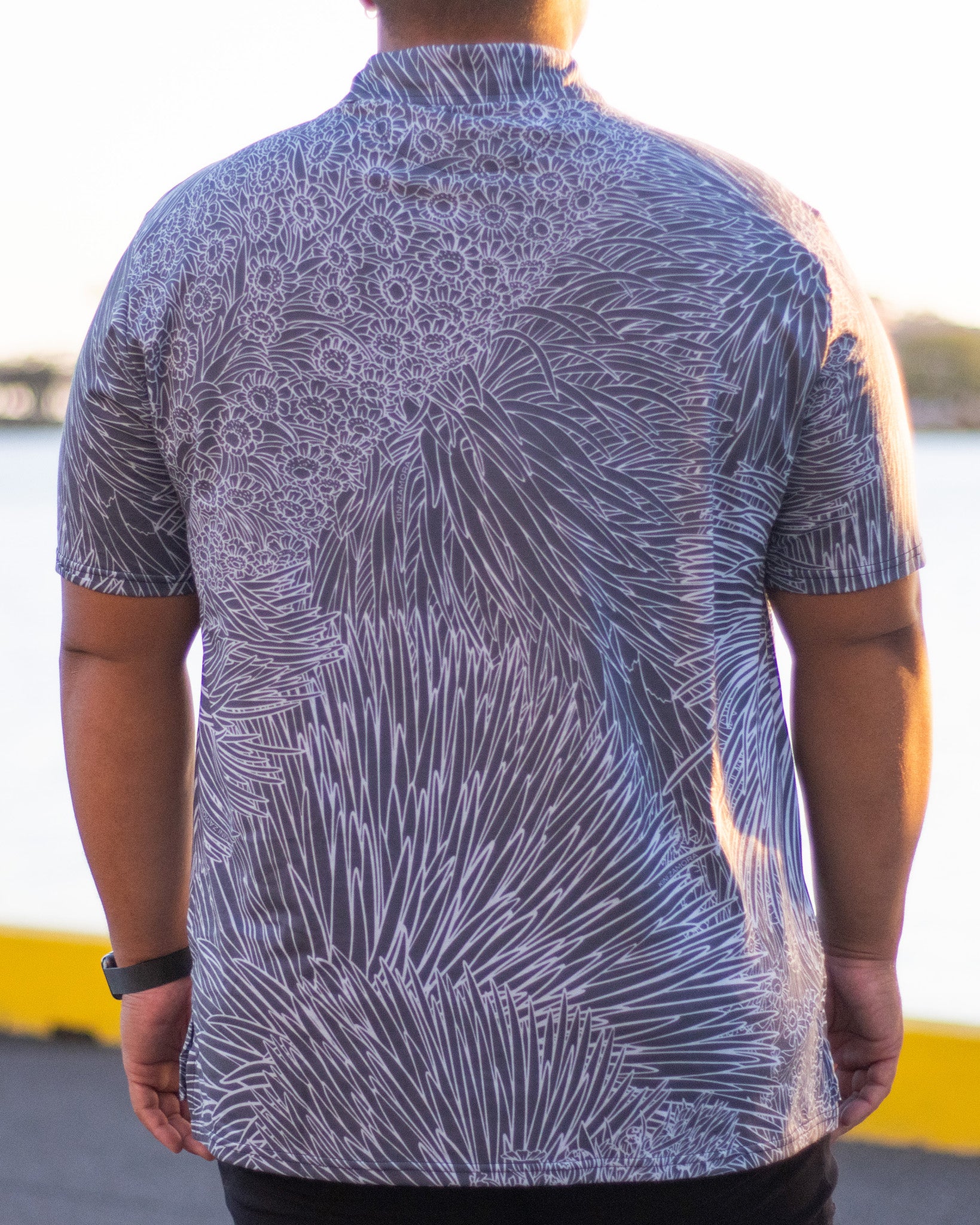 Pop-Up Mākeke - Kini Zamora - Silversword Polo Shirt - Black & White - Close-Up Back View