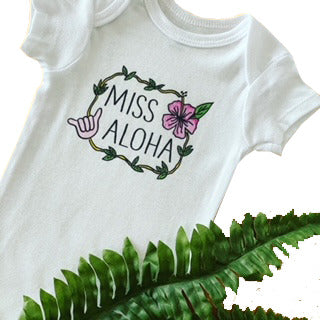 Pop-Up Mākeke - Sal Terrae - Miss Aloha Baby Onesie