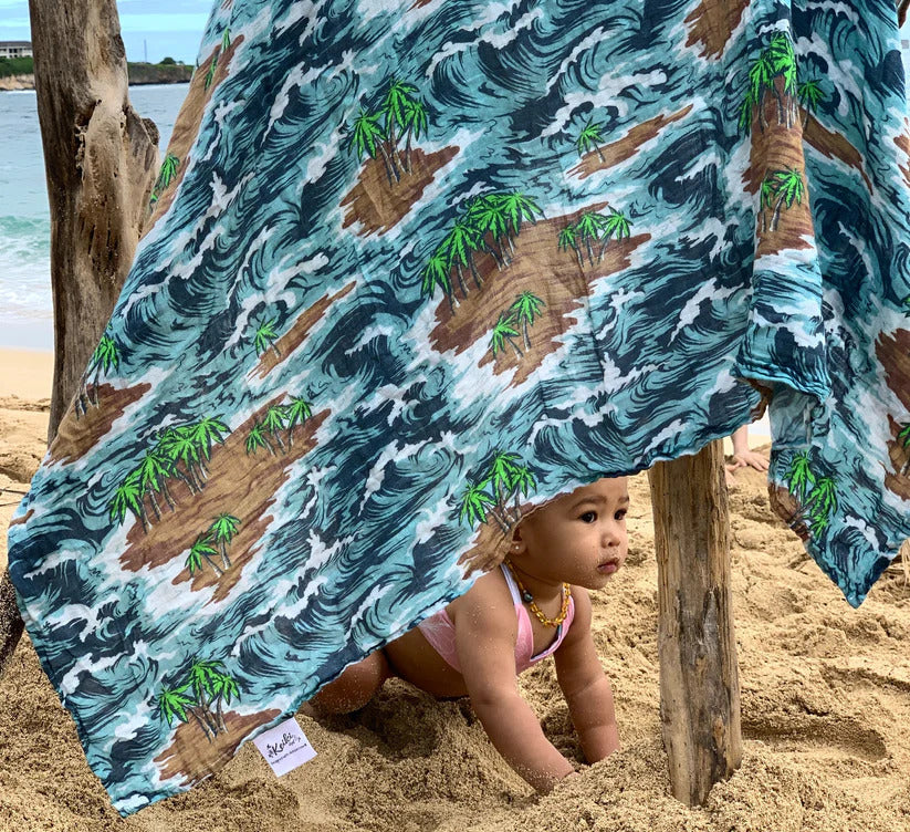 Pop-Up Mākeke - The Keiki Department - Bamboo Muslin Baby Swaddle Blanket - Camo Palms - In Use