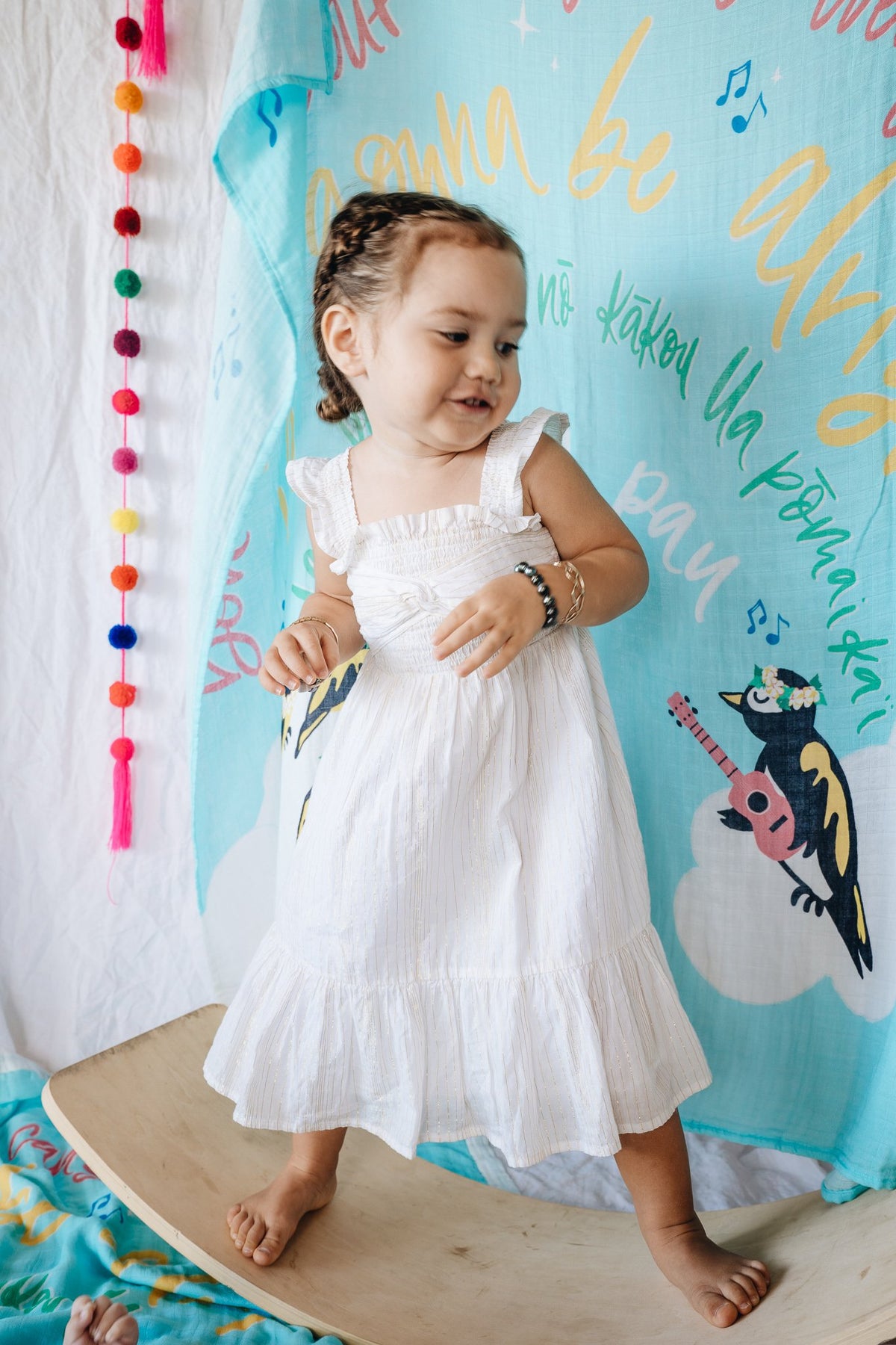 Pop-Up Mākeke - Haku Collective - Three Little Birds Baby Swaddle - In Use