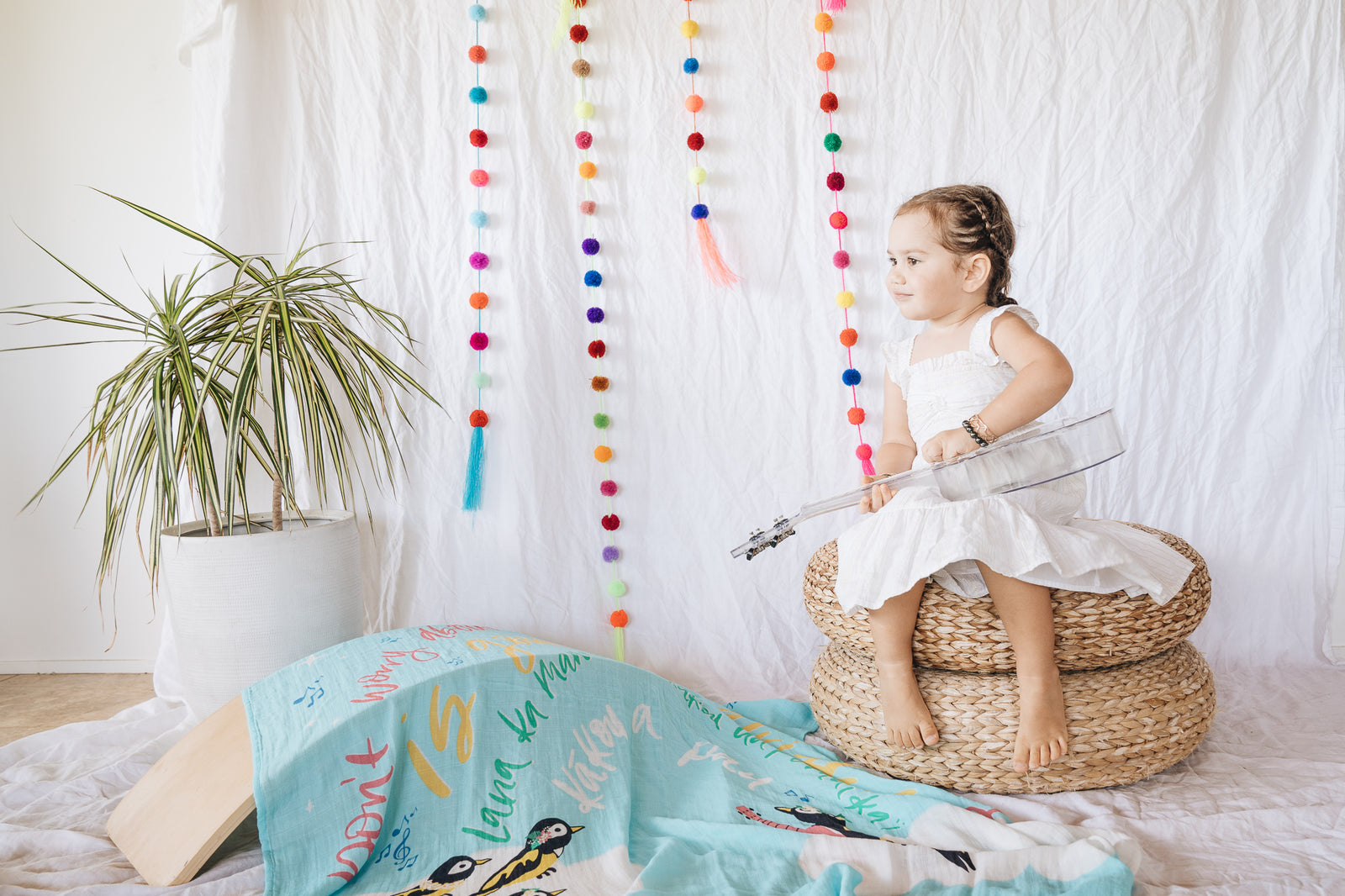 Pop-Up Mākeke - Haku Collective - Three Little Birds Baby Swaddle - In Use